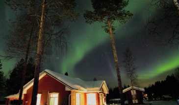 Aurora borealis adventure in finnish Lapland under the cozy cabin of Finnish Lapland northern lights magic