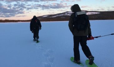 Ice fishing in Pyhä in pyhäjärvi winter nature and landscape of pelkosenniemi snow covered lake