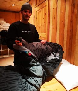 Sleeping preparation in teh snow hotel with sleeping bag- Jenna Käppi Visit Lapland