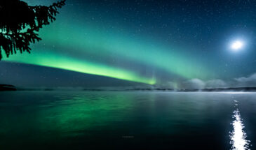 Northern lights lake reflections in rovaniemi Lapland By Jasim Sarker